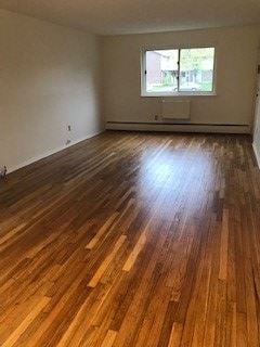 Torrington apartment for rent - a living room with a hard wood floor and a window