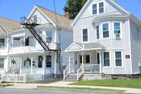 Schenectady apartment for rent - two white houses on the side of a street