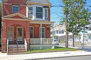 Schenectady apartment for rent - a red brick house on the corner of a street