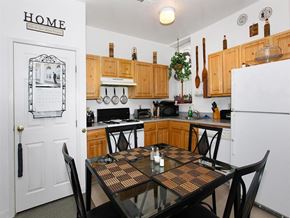 Philadelphia apartment for rent - a kitchen with a table and a refrigerator