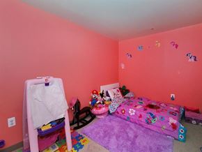 Philadelphia apartment for rent - a childs bedroom with pink walls and a pink bed