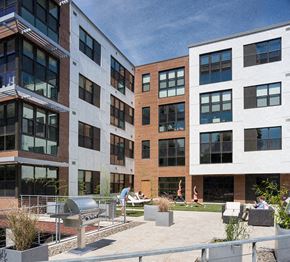 Allston apartment for rent - a view of the courtyard of a modern apartment building