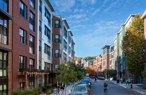 Allston apartment for rent - a view of a city street with buildings and people walking