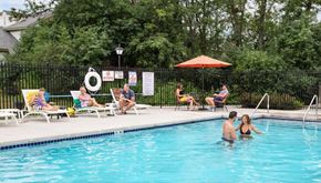 Brookfield apartment for rent - A group of people are enjoying a sunny day by the pool.