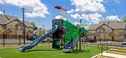 Newark apartment for rent - a playground with a green and blue playset in a yard
