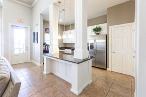 Converse apartment for rent - a kitchen with a counter top and a stainless steel refrigerator