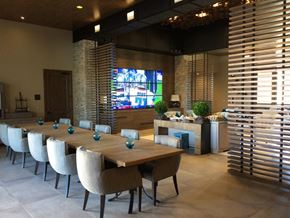 Tucson apartment for rent - a dining room with a long wooden table and chairs