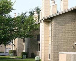 Hurst apartment for rent - A building with a green lawn in front.
