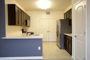 Howell apartment for rent - a kitchen with a counter top and a refrigerator
