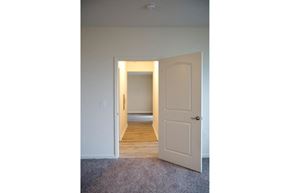 Howell apartment for rent - the door is open to a hallway with a door to a bedroom