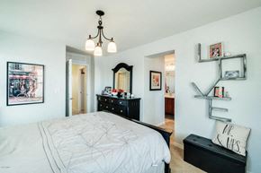 Hereford house for rent - the bedroom has a large bed and a dresser with a mirror