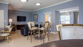 Perth Amboy apartment for rent - a dining room with a table and chairs and a television