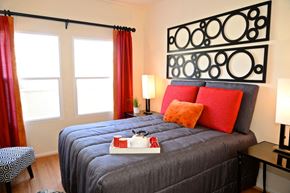 Los Angeles apartment for rent - a bedroom with a bed and a tray with a cat on it