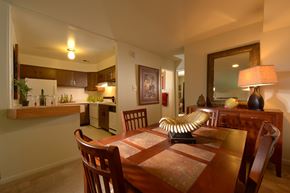 Glen Burnie apartment for rent - A dining room with a wooden table and chairs.