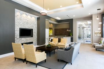 Orlando apartment for rent - a living room with couches and chairs and a fireplace