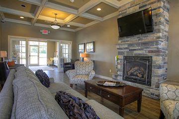 Lincoln townhouse for rent - a living room with a fireplace and a tv