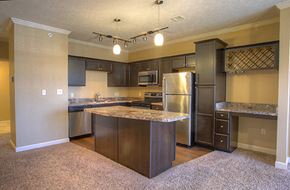 Lincoln townhouse for rent - a large kitchen with stainless steel appliances and granite counter tops