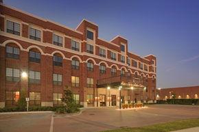 Houston apartment for rent - the building in which the hotel is located is lit up at night