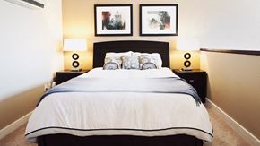 Ottawa apartment for rent - Bedroom with Two Night Tables and Wall Art
