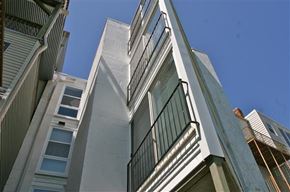 Cincinnati apartment for rent - A tall building with a balcony on the side.