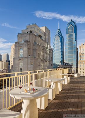 Philadelphia apartment for rent - a terrace with tables and chairs on top of a building