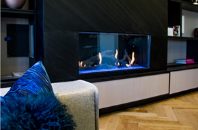 Philadelphia apartment for rent - a fireplace with a roaring fire in a living room