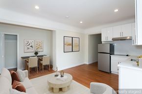 San Francisco apartment for rent - A modern living room with a dining table and chairs.