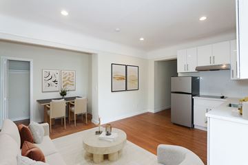 San Francisco apartment for rent - A modern living room with a dining table and chairs.
