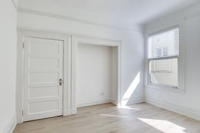 San Francisco apartment for rent - A white door is on the left and a window with blinds is on the right.