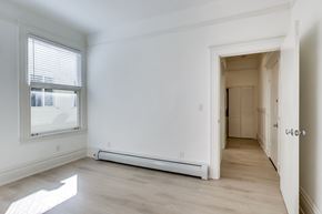 San Francisco apartment for rent - A white room with a window and a door.