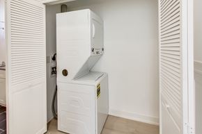 San Francisco apartment for rent - A white refrigerator is installed in a narrow space between two walls.