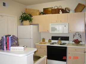 Houston apartment for rent - a kitchen with white appliances and white cabinets