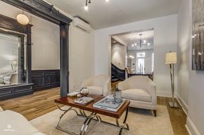 Brooklyn apartment for rent - A living room with a wooden floor and a white sofa.