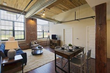 Worcester apartment for rent - the living room of an apartment with a dining room table and a couch