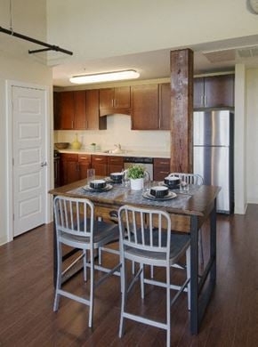 Worcester apartment for rent - a kitchen with a large island with chairs and a table