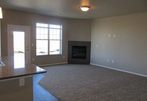 West Fargo townhouse for rent - an empty living room with a fireplace