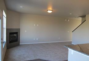 West Fargo townhouse for rent - an empty living room with a fireplace