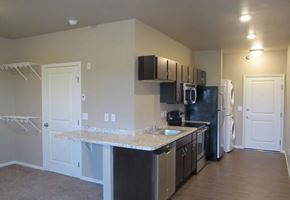Moorhead apartment for rent - a kitchen with a counter top and a refrigerator