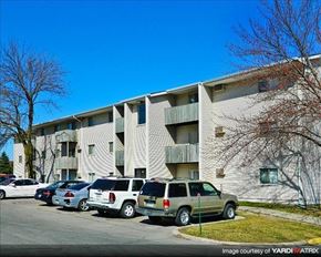 Pleasant Hill apartment for rent - an apartment building with cars parked in a parking lot