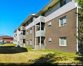 Pleasant Hill apartment for rent - a brick apartment building with balconies on the side