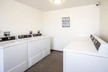On-site laundry room with washers and dryers