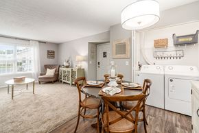 Lewis Center apartment for rent - A dining room with a wooden table set for two.
