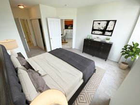Brookfield apartment for rent - a bedroom with a bed and a dresser and a bathroom