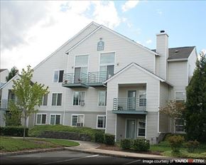 Hillsboro apartment for rent - A two-story house with a balcony on the second floor.