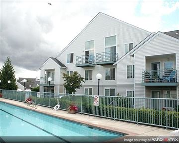 Hillsboro apartment for rent - A pool in front of a building with a no swimming sign.