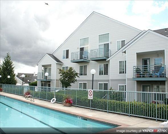 Hillsboro apartment for rent - A pool in front of a building with a no swimming sign.