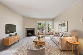 Hillsboro apartment for rent - A living room with a fireplace and a couch.