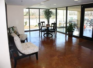 New Orleans apartment for rent - a living room with a table and chairs and sliding glass doors