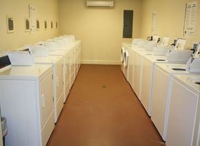 New Orleans apartment for rent - a row of white washing machines in a room