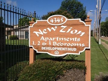 Shreveport apartment for rent - A sign for New Zion Apartments with 1, 2, and 3 bedrooms.